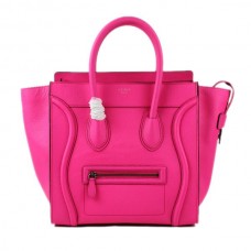 Bolso tote grande Celine Luggage de piel rosa neón.