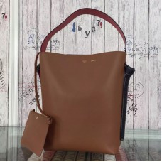 Bolso pequeño Celine Twisted Cabas en piel de becerro color camel/naranja.