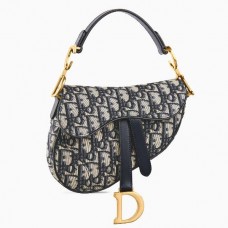 Bolso mini Saddle de Dior en lona jacquard oblicua azul.