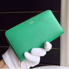 Cartera multifunción con cremallera de Celine en piel de cabra verde.